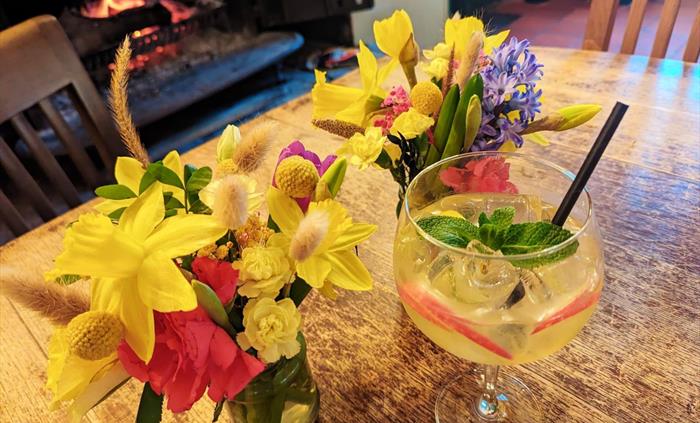 Freshly cut flowers and in house made summery cocktails